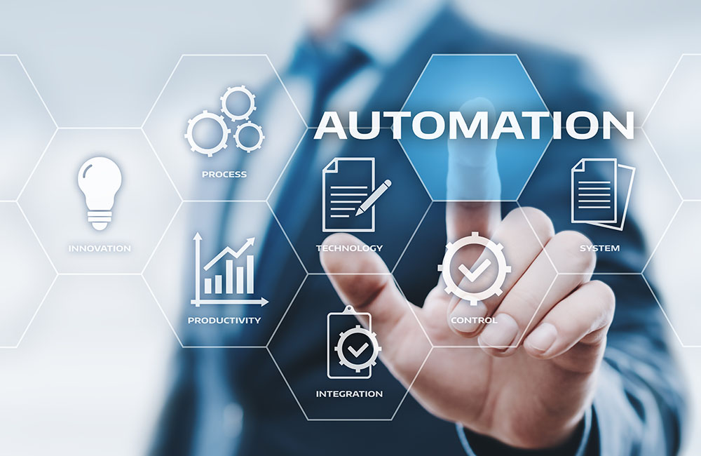 Businessman touching a light blue and white hexagon grid of automation icons around the word Automation